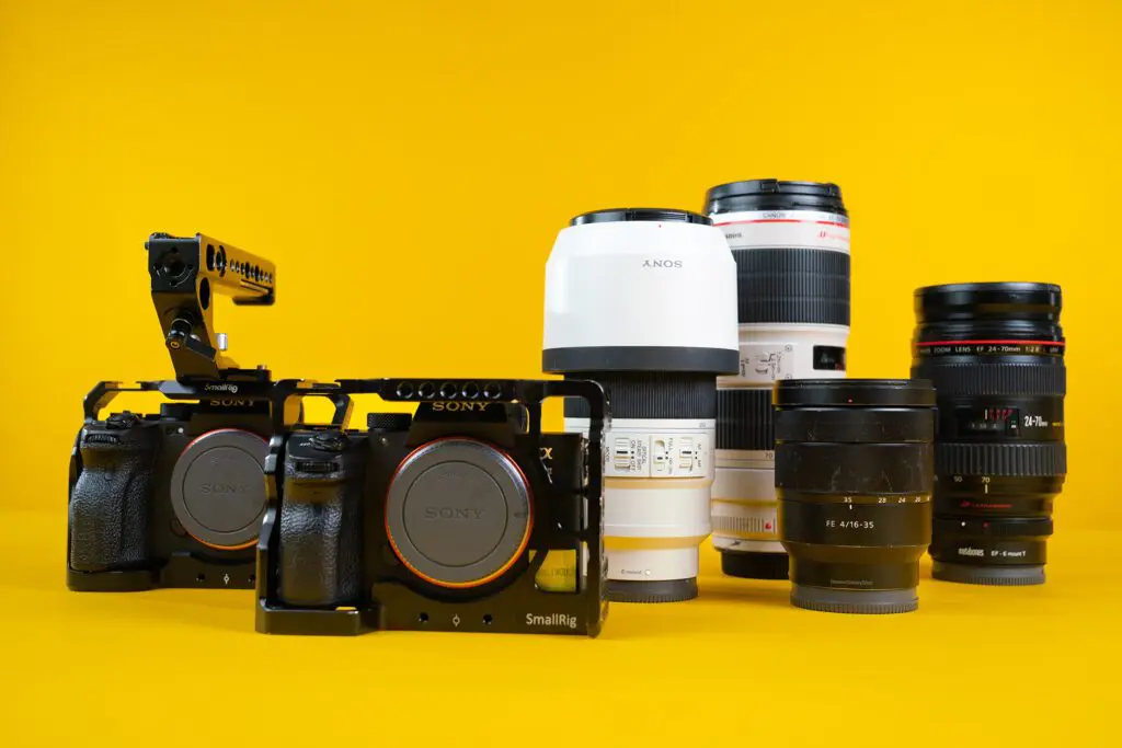 Sony cameras and lenses on yellow backdrop