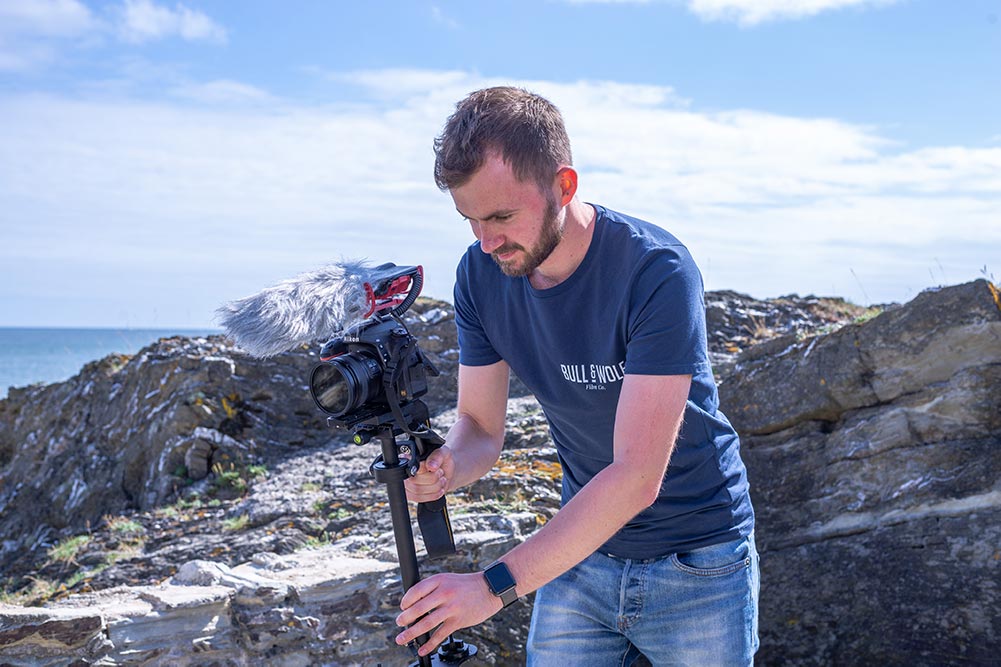 Chris setting up a camera to film at the beach.