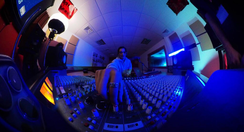 Fish eye lense shot of person in sound booth